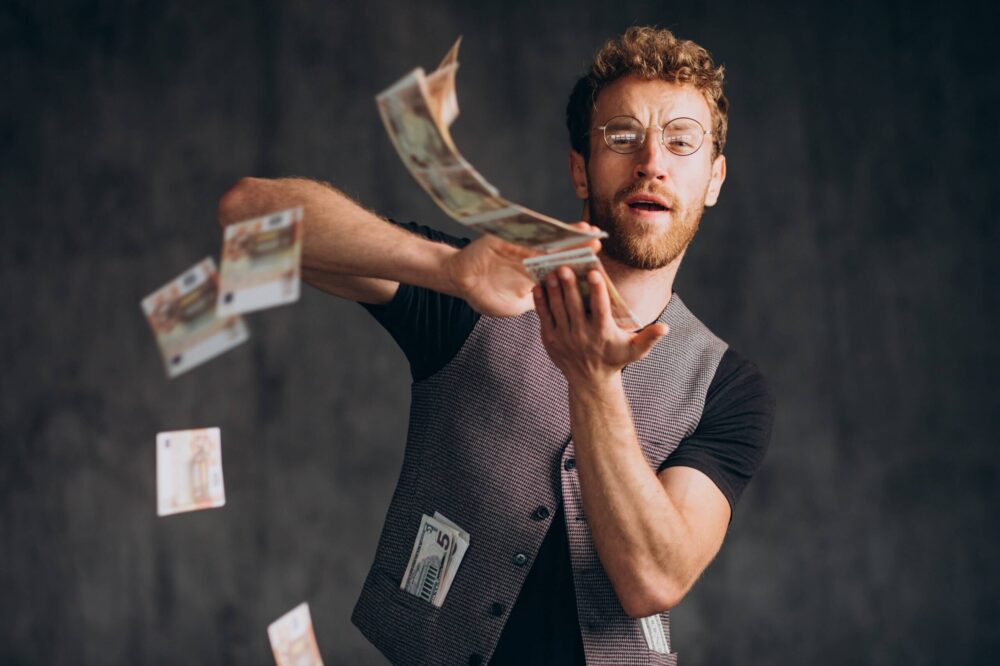 man with banknotes isolated studio min 2 scaled e1661202232747